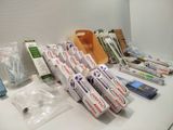many toothbrushes and toothpaste packages on the counter