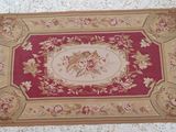 a rug on the floor with a picture of a woman on it