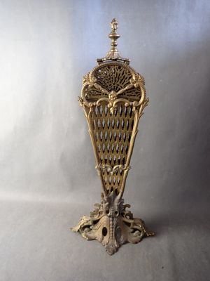 an image of a gold vase sitting on top of a table