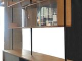 a room that has a shelf and a tv in it