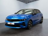 a blue car is parked in a white room with a black floor