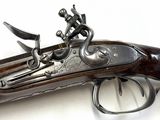 a close up of a gun on a white surface with a white background
