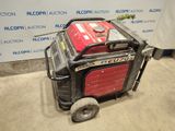 an image of a small portable generator sitting in a garage