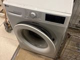 a washer and dryer sitting on the floor in a room