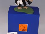 an image of a figurine of a monkey and a dog on top of a blue box