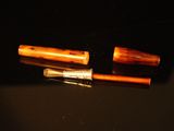 two pens that are sitting on top of a table