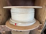 an image of a stack of white wires in a wooden box