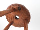 a close up of a wooden object with a hole in it