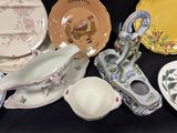 many different types of plates and bowls on the table