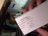 a person holding a white box in their hand