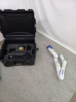 a black case that is sitting on the floor next to a bottle of water