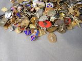 a pile of gold, silver, and other metal items on a table