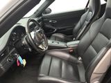 the interior of a car with black leather seats and a steering wheel