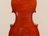 an old violin with a wooden back and a long neck