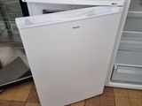 a white refrigerator with a door open in a kitchen