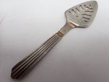 a silver spoon and a fork on a white surface