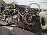 a pile of wires and other electrical equipment on top of a table