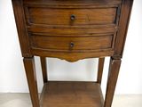 an old wooden table with a drawer on top of it