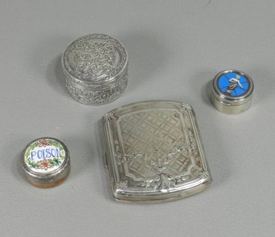 several silver objects are sitting on a table with a white background