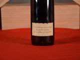 a bottle of wine that is sitting on a table