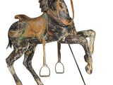 a statue of a horse that is standing on a stand