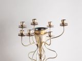 an image of a silver candelier with five candles on a white background