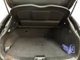 a trunk of a car with a blue towel in the trunk