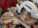 a picture of a circular saw on a table in a workshop