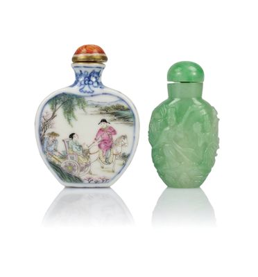 two green glass snuff bottles sitting next to each other on a white surface