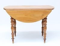 Table à deux volets en noyer, quatre pieds de forme balustre…