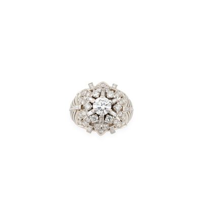 a close up of a diamond ring on a white background