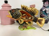 a figurine of a fish that is sitting on a table