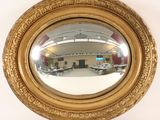a mirror that is sitting on the wall in the room