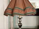 a lamp that is sitting on a table in a room