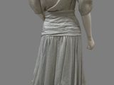 an image of a mannequin wearing a gray dress and black shoes