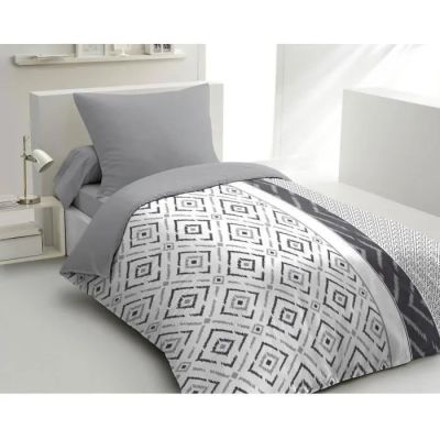 une photo d'un lit avec une couette en noir et blanc