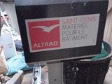 a black box with a red and white sign on it