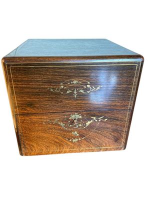 an image of a wooden box with a decorative design on it