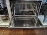 a dishwasher in the middle of a kitchen counter