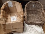two wicker chairs sitting next to each other on the floor