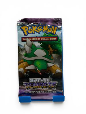 a close up of a box of pokemon trading cards on a white background