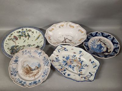 six plates with blue and white designs on them sitting on a table