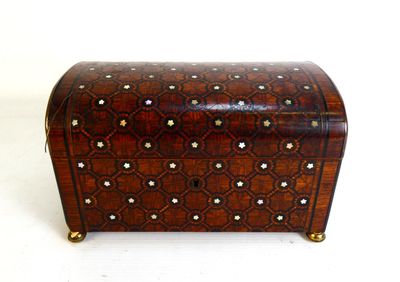 a small wooden box with a decorative design on it