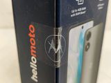 the box of the motorola phone is open on the table