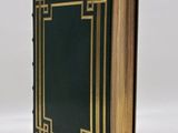 a black book with gold trim and a gold border on the cover