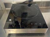 stainless steel counter top with a black burner on top of it