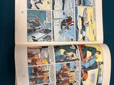 a comic book open to a page of comics