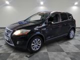 the 2013 ford escape is shown in a showroom