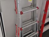 two ladders sitting next to each other in a room