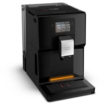 une machine à café noire posée sur un plan de travail blanc